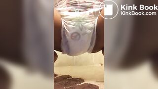 Ebony chick messes diaper