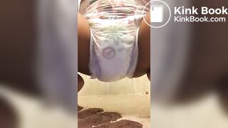 Ebony chick messes diaper