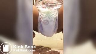 Ebony chick messes diaper