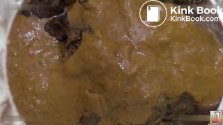 Women filling a glass box with shit