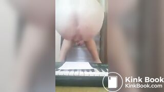 Girl shits on piano