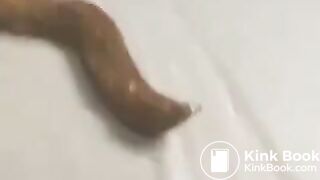 Naked Jap babe manage to poop a long turd in library