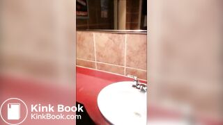 Woman shitting public toilet at restaurant.