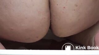 Fatty taking an enema from a shower hose