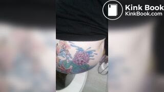 Tatoed woman take a big dump