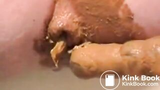 Girl puts dildo in pooping ass