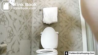 Girl shitting on the toilet