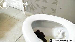 Girl shitting on the toilet