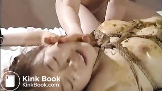 Bounded girl gets an enema on her face and gets fucked by a strap-on