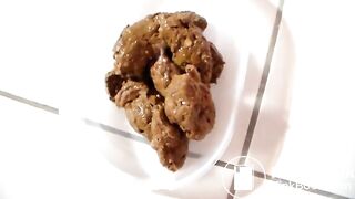 Slim amateur shitting into a plastic container