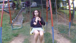 Cutie in Pigtails poops on a swing