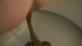 Women shitting on toilet