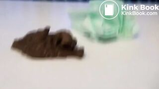 Fit webcam model shitting on a table and filming it