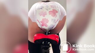 Girl poops diaper on bike