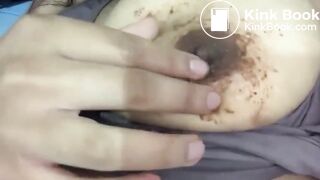 Rubbing shit on nipples