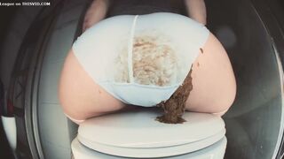 A girl defecates in her blue underwear.