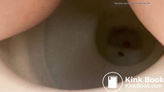 Girl shitting into toilet