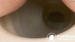 Girl shitting into toilet
