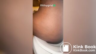 Sexy ebony on toilet