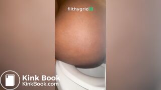 Sexy ebony on toilet