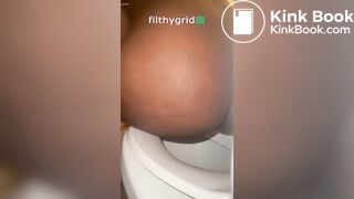 Sexy ebony on toilet