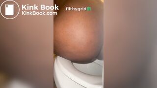 Sexy ebony on toilet