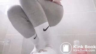 Filling A Jar With Her Shit