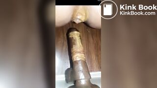 Girl pooping on anal dildo