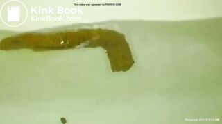 constipated asian girl pushes out huge shit in the tub