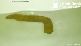 constipated asian girl pushes out huge shit in the tub