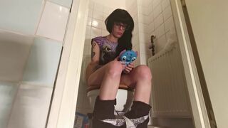 Teen ager pooping on toilet