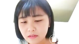 Asian girl dropping a nice log in the toilet