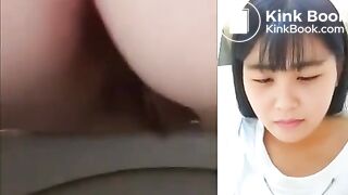 Asian girl dropping a nice log in the toilet