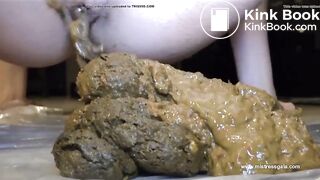 girl squirts out a tasty looking pile of shit (closeup)