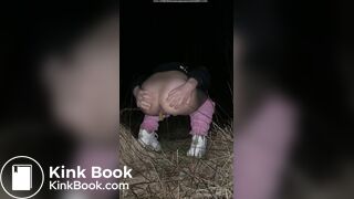 Girl pooping at night in the field