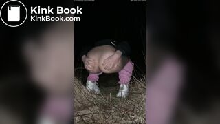 Girl pooping at night in the field