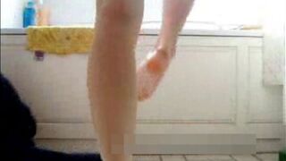 Young girl on bathroom floor