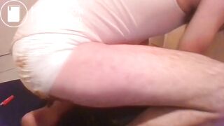 AB boy plays with poopy diaper