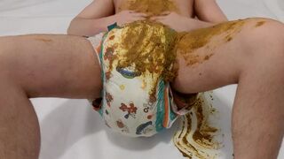 AB boy smearing shit from his very messy diaper